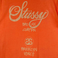 STUSSY ステューシー SANTA ANA ワールドツアー Tシャツ オレンジ sizeL 瑞穂店