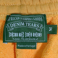 DENIM TEARS デニムティアーズ 24AW CPFM カクタスプラントフリーマーケット Wreath Sweatpants リース プリント スウェットパンツ イエロー Size M 福生店