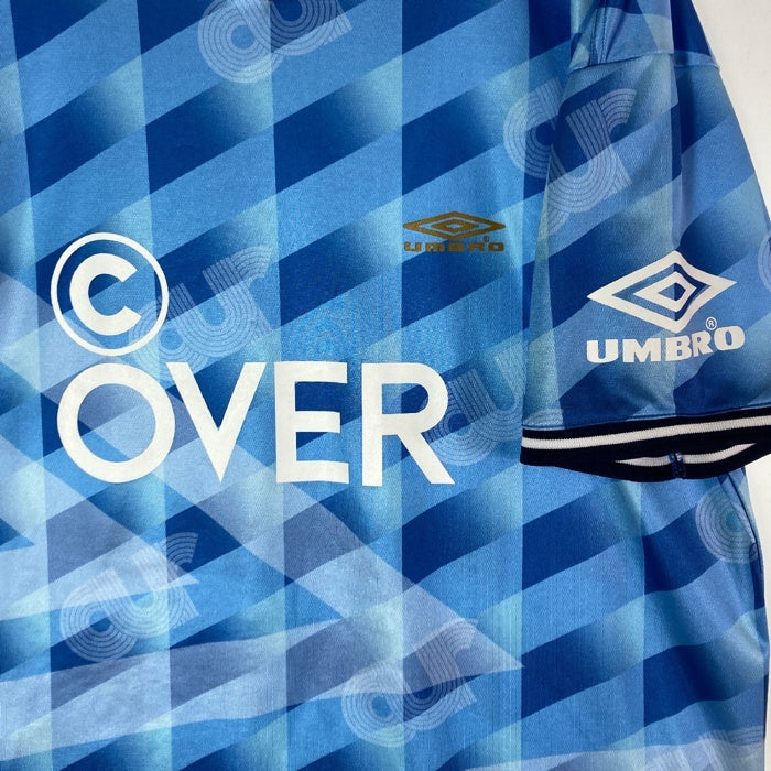 UMBRO アンブロ ×(C)OVER FOOTBALL SHIRT ブルー 総柄 sizeM 瑞穂店