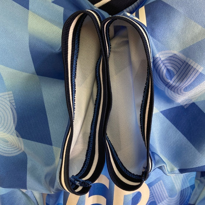 UMBRO アンブロ ×(C)OVER FOOTBALL SHIRT ブルー 総柄 sizeM 瑞穂店