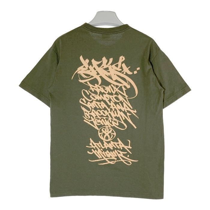 STUSSY ステューシー ワールドツアー Tシャツ カーキ sizeM 瑞穂店