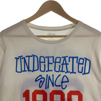 STUSSY ステューシー UNDEFEATED since 1980 アンディフィーテッド プリントTシャツ ホワイト Size L 福生店