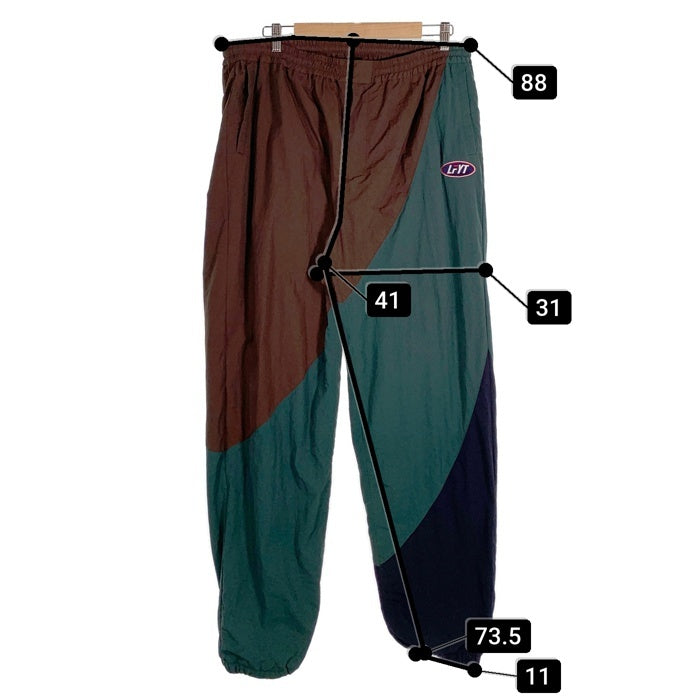 LFYT エルエフワイティー FILA フィラ Nylon Track Pants ナイロントラックパンツ ブラウン LA221002 Size XXL 福生店