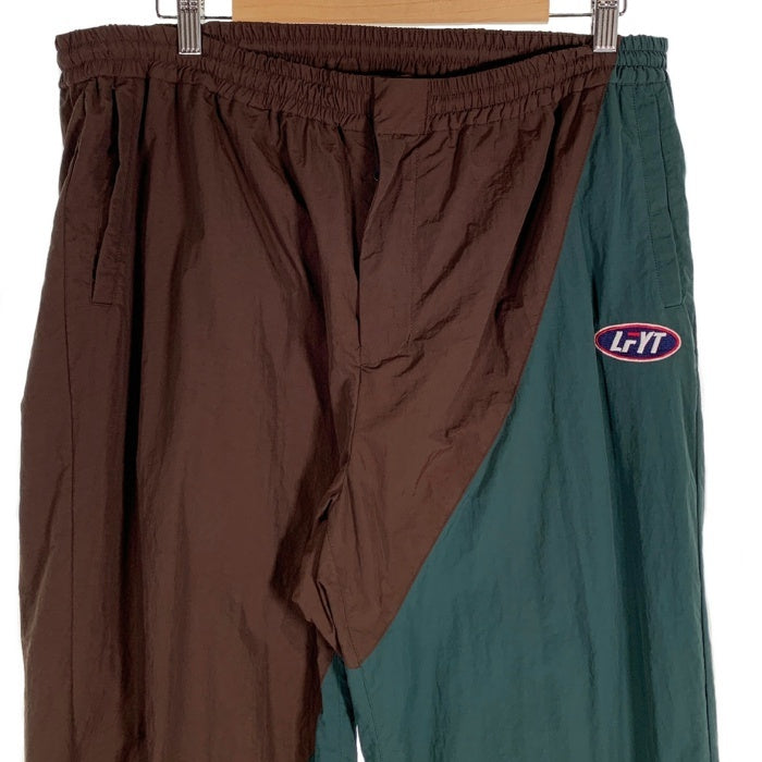 LFYT エルエフワイティー FILA フィラ Nylon Track Pants ナイロントラックパンツ ブラウン LA221002 Size XXL 福生店