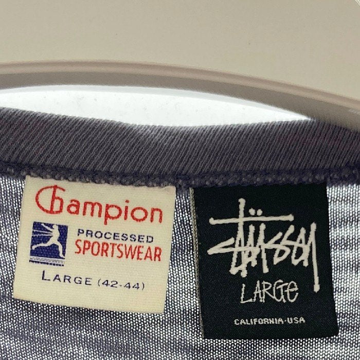 STUSSY ステューシー × champion チャンピオン ランタグ ローラTシャツ パープル sizeL 瑞穂店