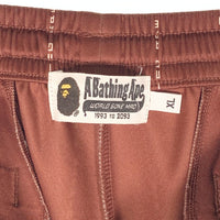 A BATHING APE アベイシングエイプ Text Stripe Jersey Pants サイドライン ジャージパンツ ブラウン 001PTH701005J Size XL 福生店