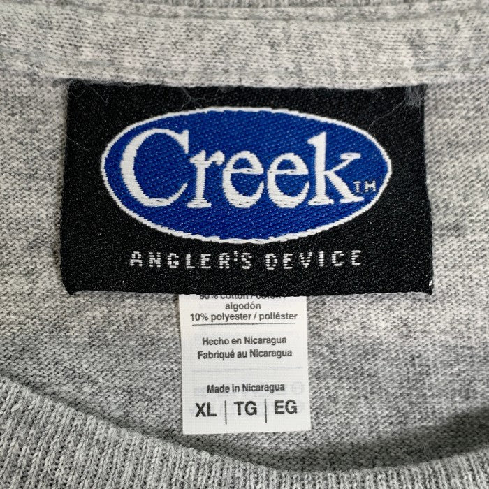 Creek Angler's Device クリーク NATURE APPEARS AS A SYMBOL プリントTシャツ グレー Size XL  福生店
